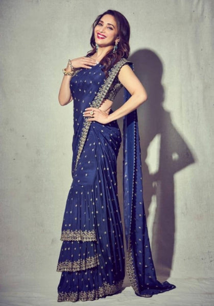 Madhuri Dixit glances majestic in Arpita Mehta's imperial blue layered unsettle saree!